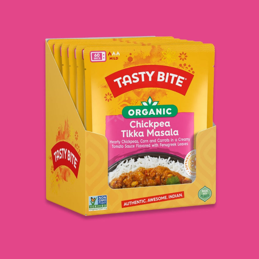 Tasty Bite Organic Chickpea Tikka Masala 6 pack packaging on a pink background
