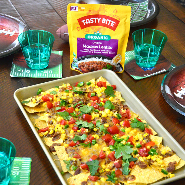 Tailgate nachos with delicious toppings including Tasty Bite Organic Madras Lentils