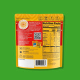 Spinach & Paneer Nutrition facts label on a yellow food package against a green background