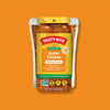 Tasty Bite Butter Chicken simmer sauce package on an orange background