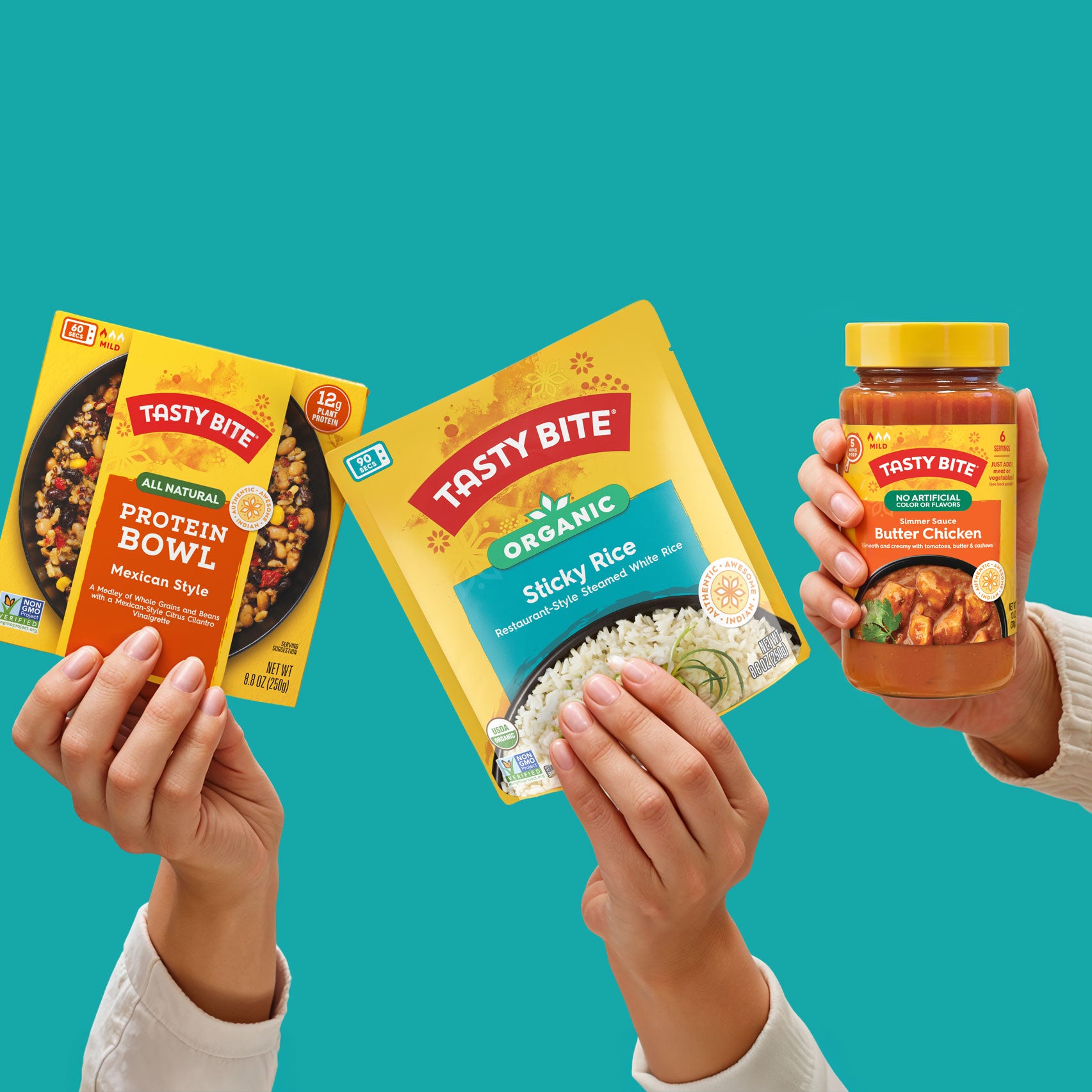 Hands holding Tasty Bite Mexican Style Protein Bowl, Organic Sticky Rice, and Butter Chicken Simmer Sauce on teal background