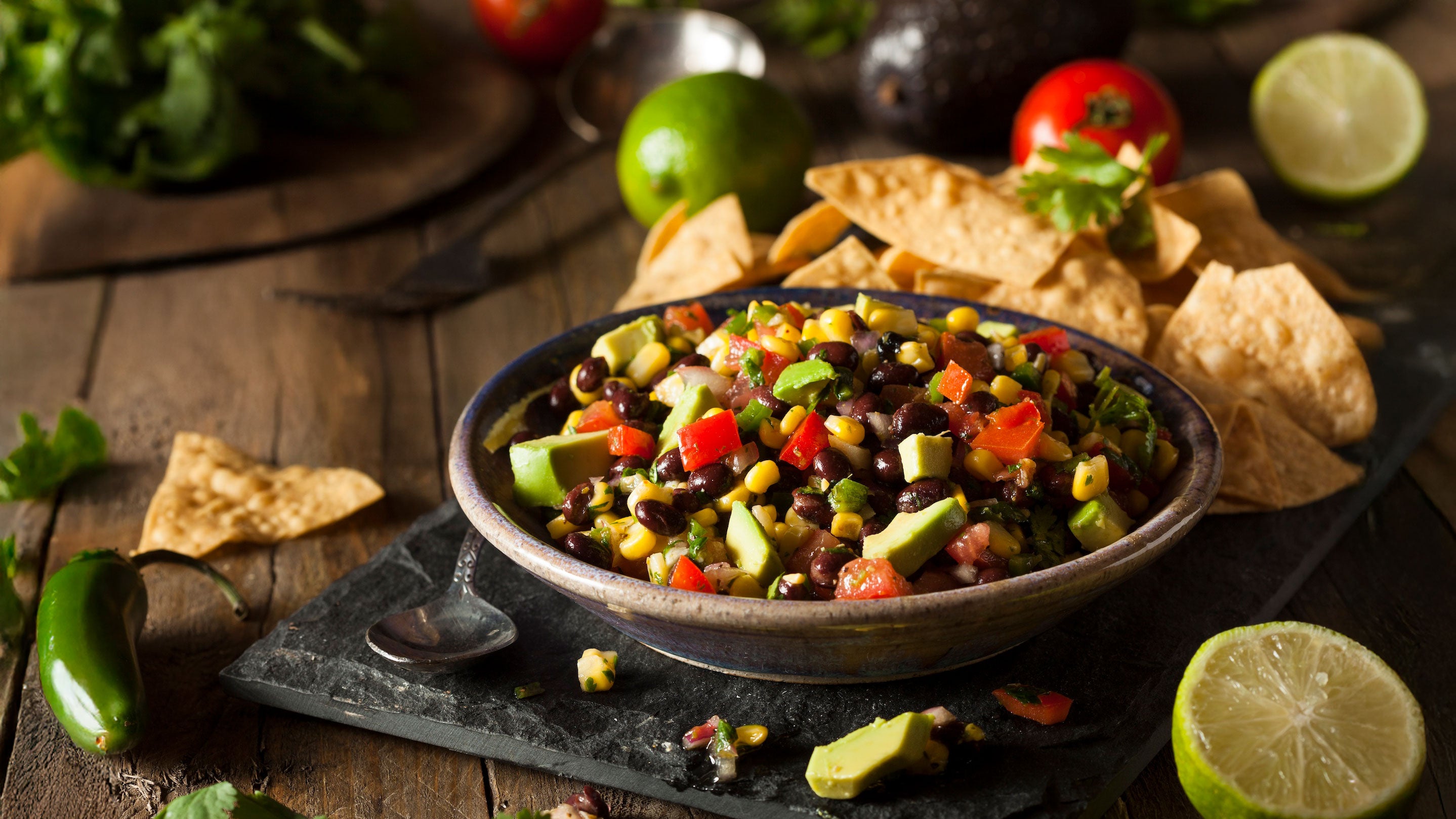 Cowboy caviar with black beans, corn, avocado, and tortilla chips